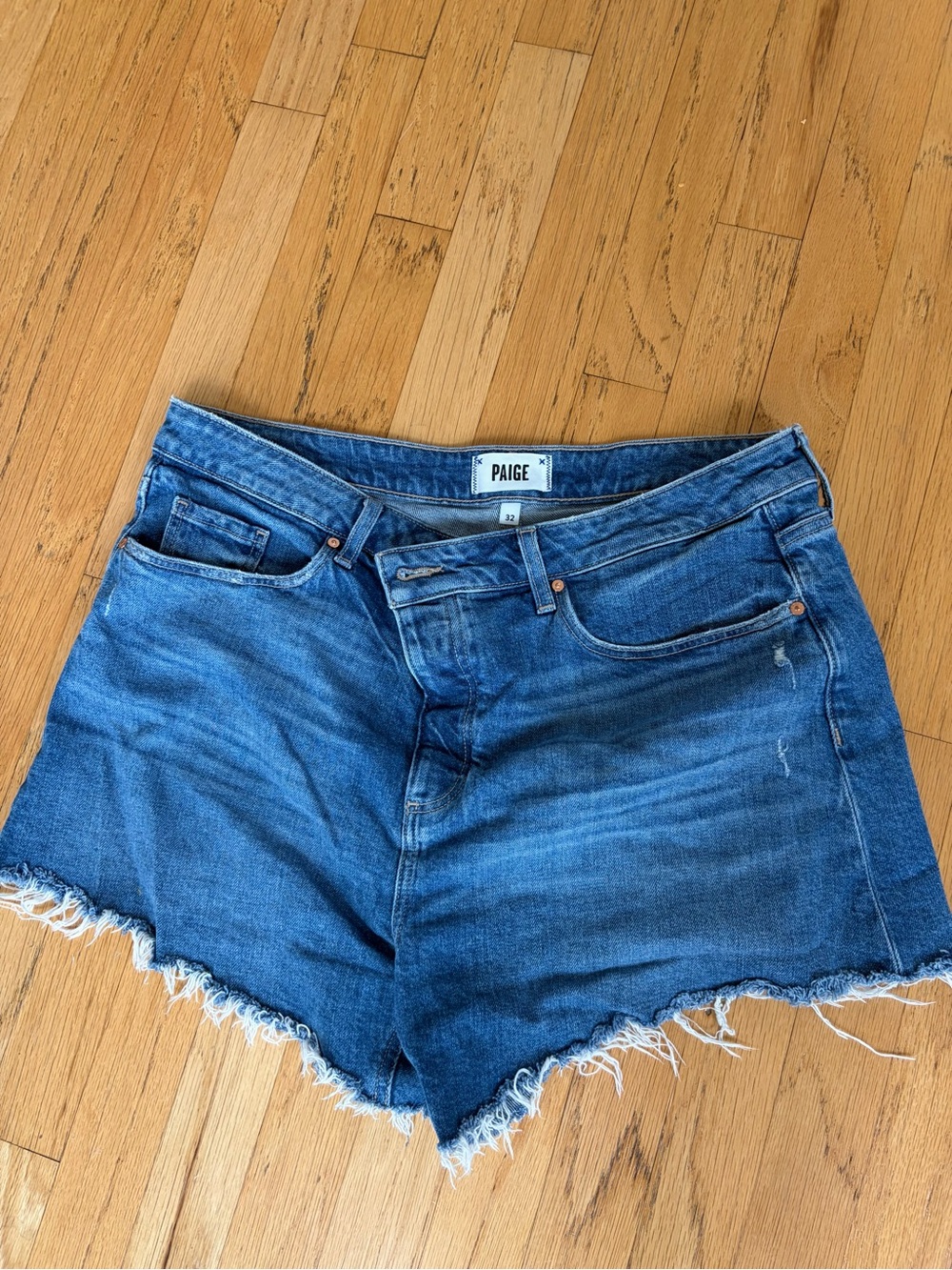 PAIGE Medium Blue Distressed Denim Shorts with Frayed Hem